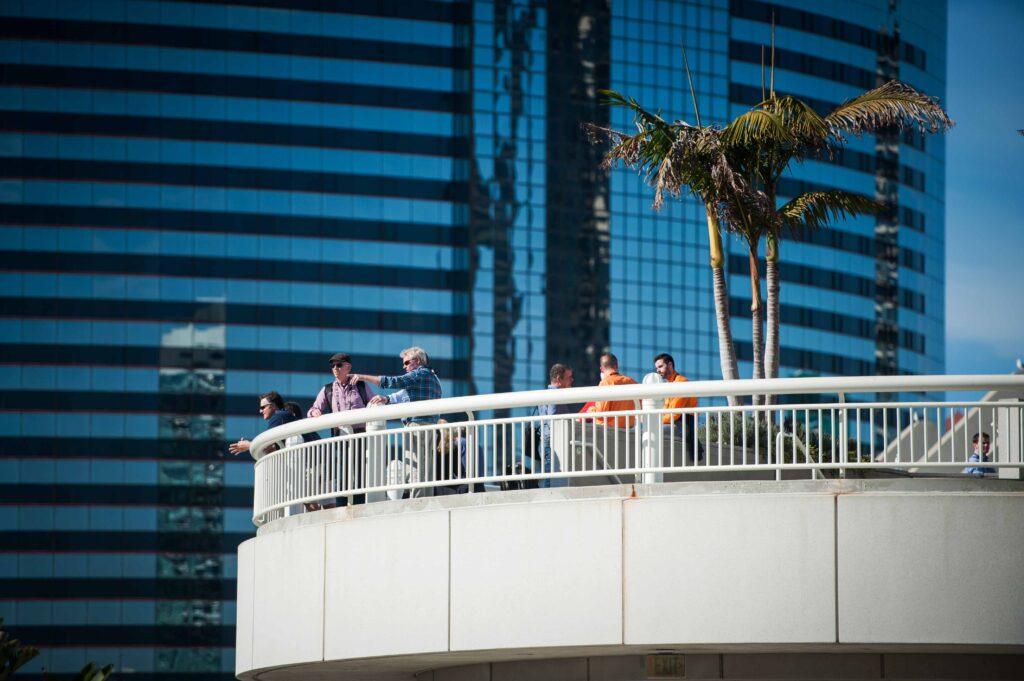 People enjoying a view from a round balcony at the San Diego Convention Center