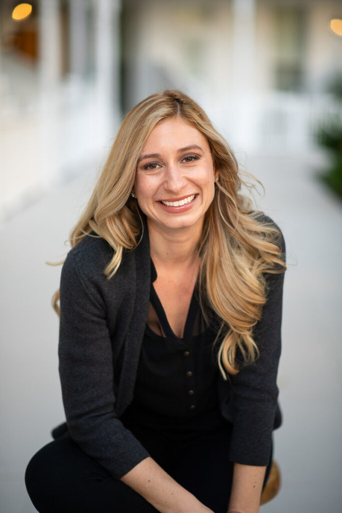 Woman in a black casual outfit, smiling for her personal branding photo