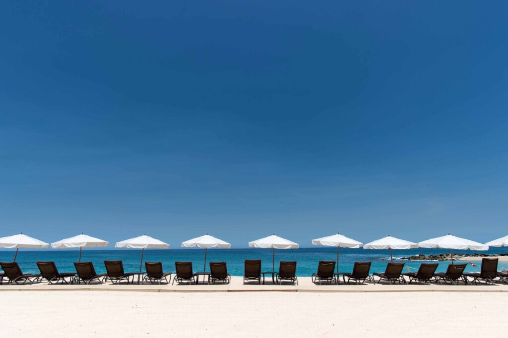 Chairs with umbrella lined up in a beach 